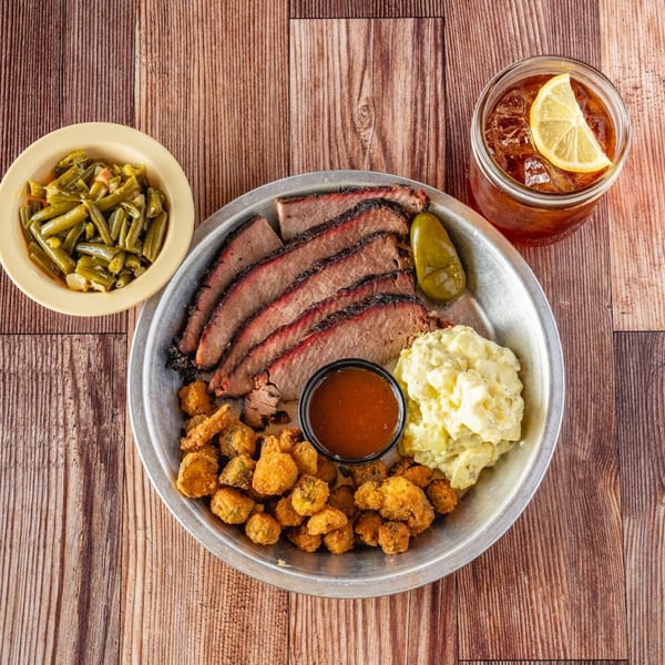 Bowie Barbeque brisket platter with fried okra, potato salad, green beans, and iced tea.